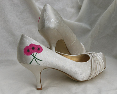 Hot pink flowers on wedding shoes